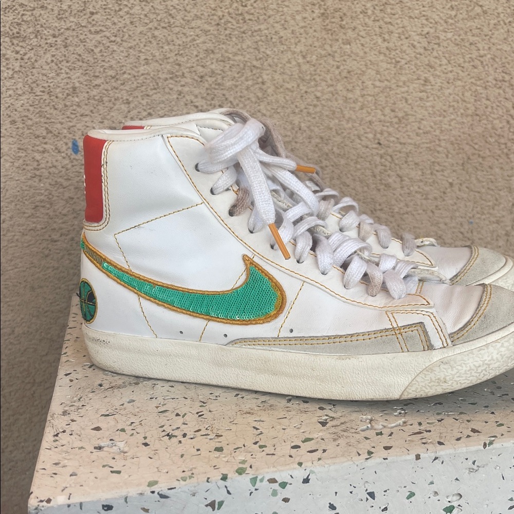 Nike White High-Top Sneakers with Teal Swoosh and Red Heel